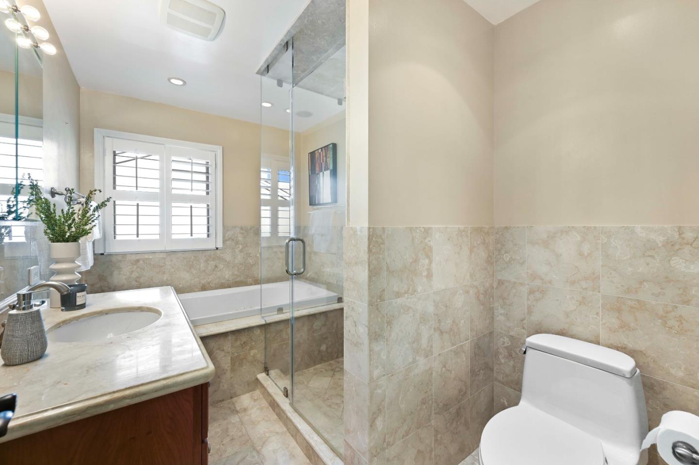 754 26th Avenue San Mateo, CA 94403 - Photo 40 of 57 a bathroom with a granite countertop sink toilet and shower