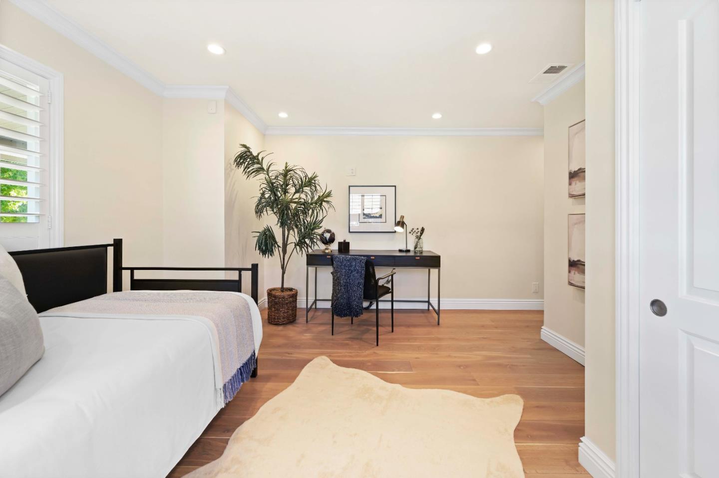 754 26th Avenue San Mateo, CA 94403 - Photo 43 of 57 a bedroom with a bed and a table in it