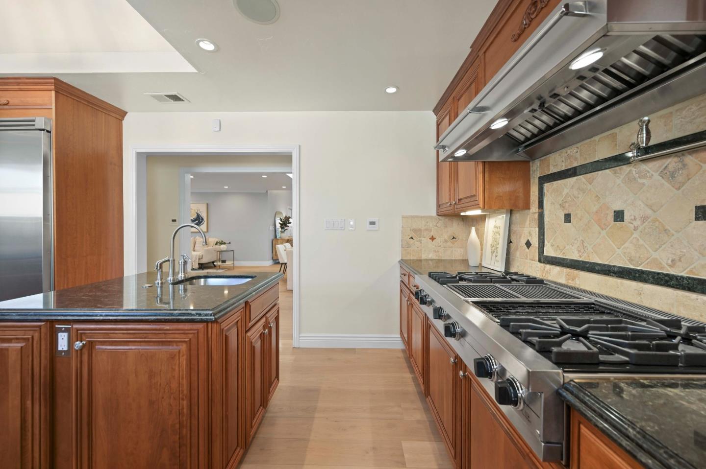 754 26th Avenue San Mateo, CA 94403 - Photo 47 of 57 a kitchen with stainless steel appliances granite countertop a stove and a sink