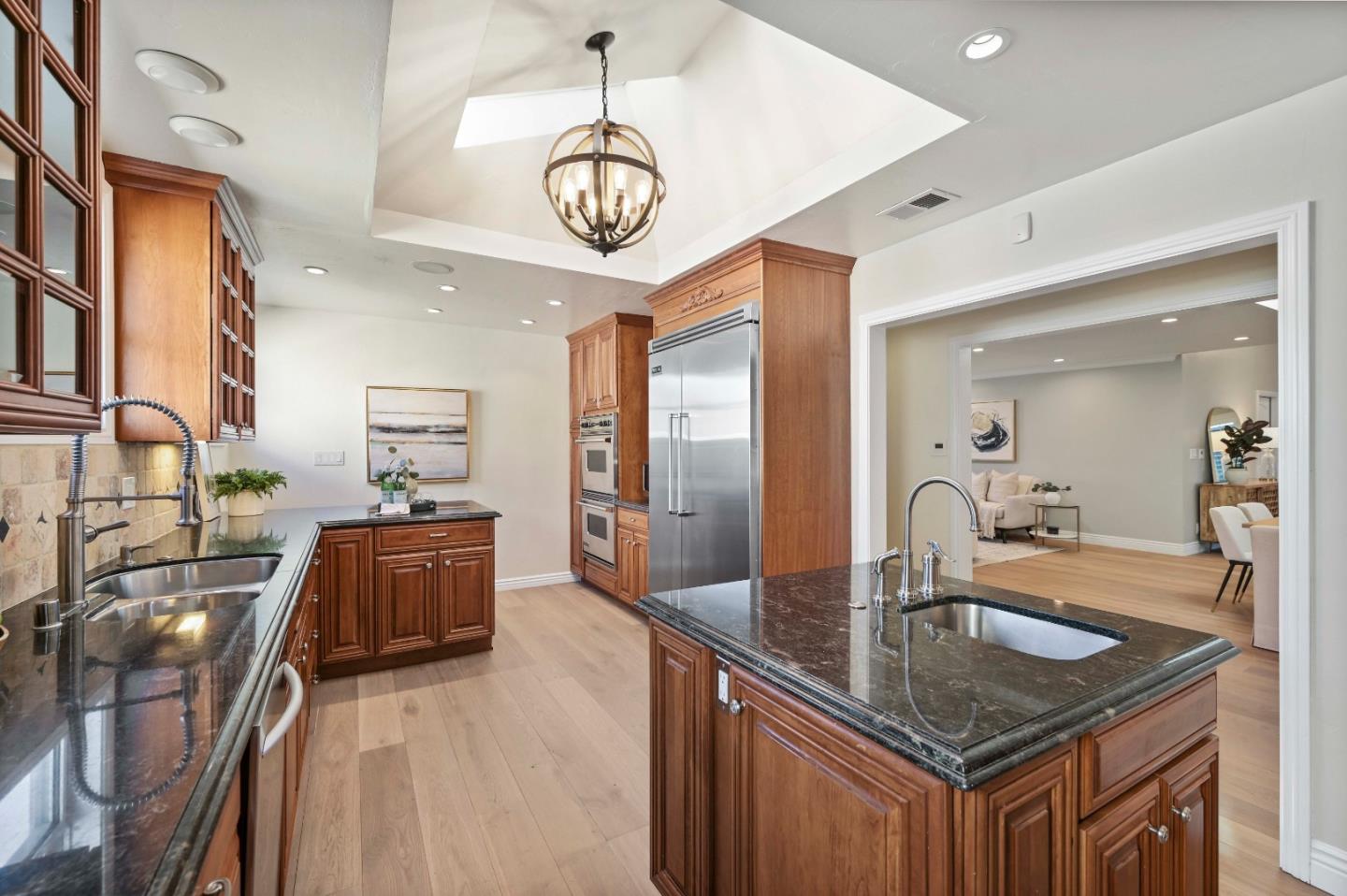754 26th Avenue San Mateo, CA 94403 - Photo 48 of 57 a kitchen with stainless steel appliances granite countertop a sink a stove and a refrigerator