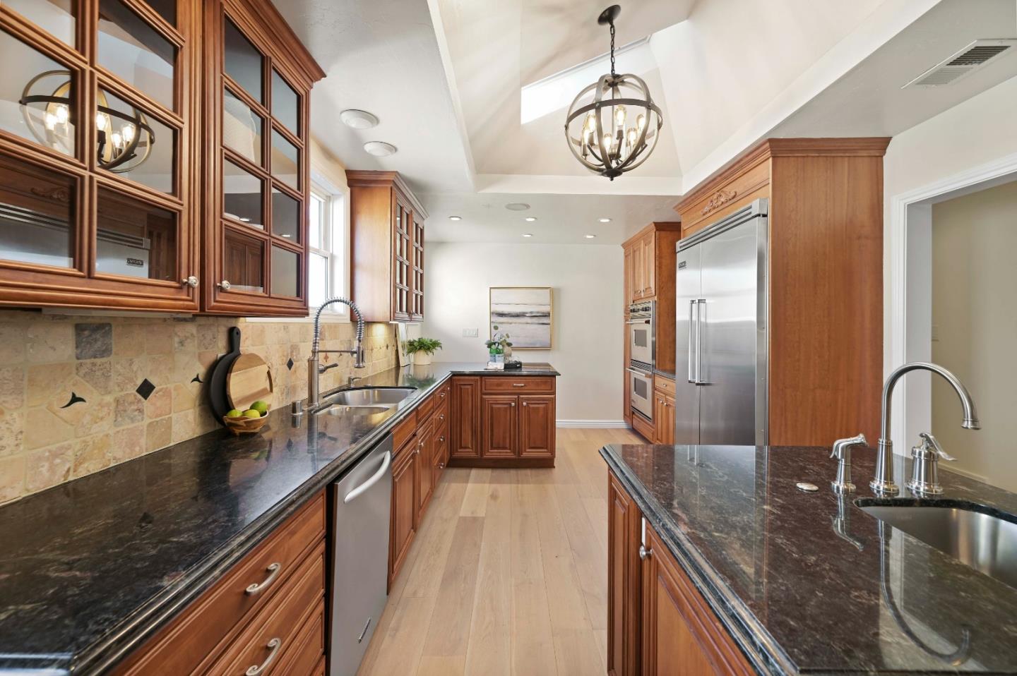754 26th Avenue San Mateo, CA 94403 - Photo 49 of 57 a kitchen with stainless steel appliances granite countertop a sink a stove and a wooden floors
