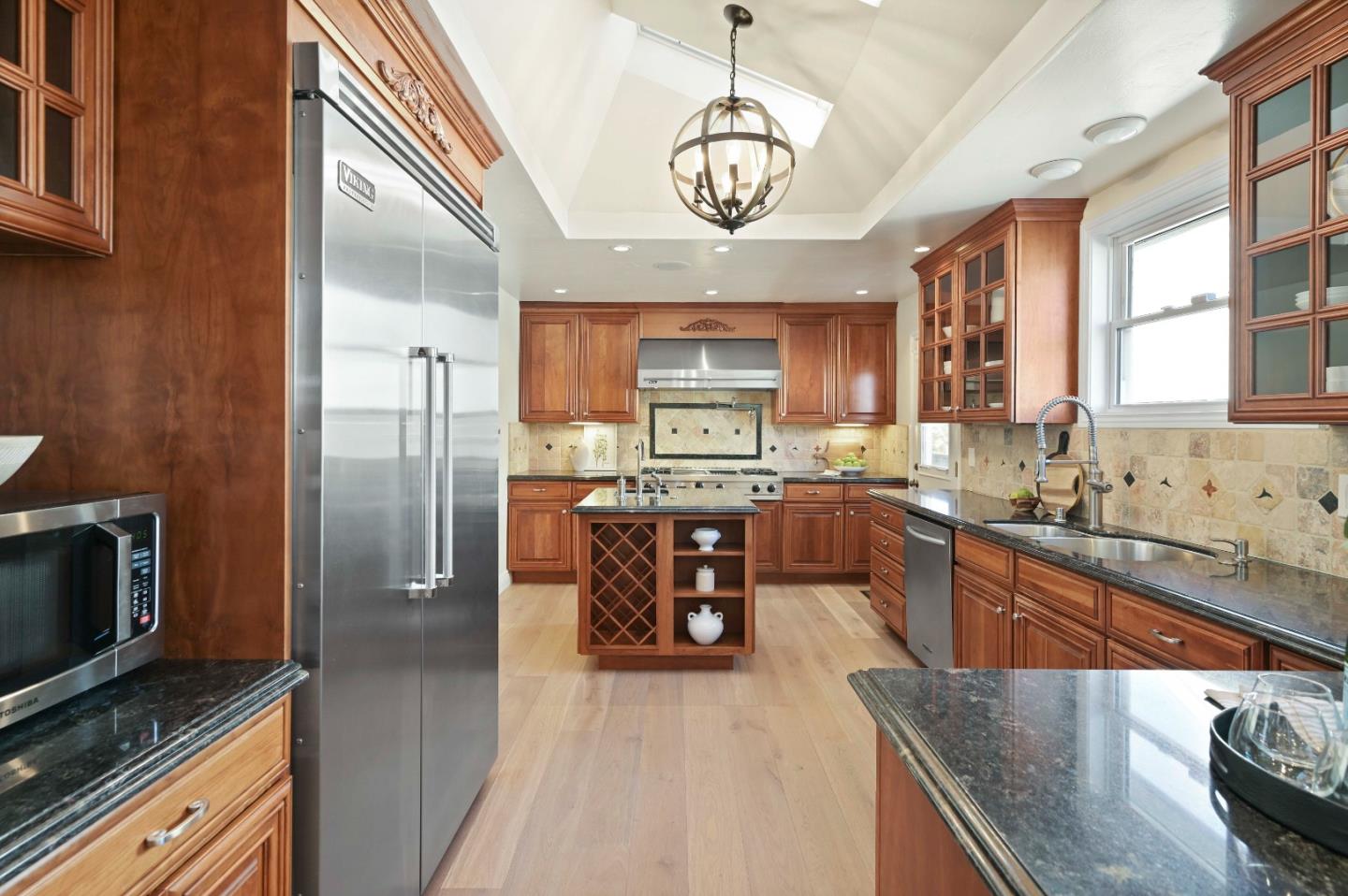 754 26th Avenue San Mateo, CA 94403 - Photo 50 of 57 a kitchen with stainless steel appliances granite countertop a refrigerator a stove top oven a sink and dishwasher