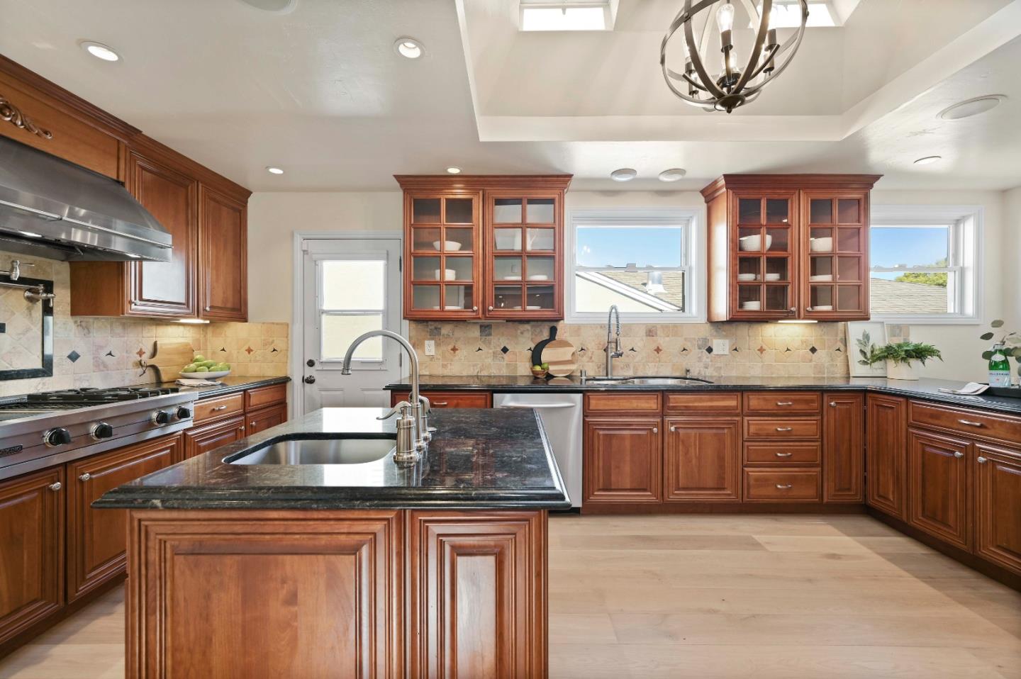 754 26th Avenue San Mateo, CA 94403 - Photo 52 of 57 a kitchen with stainless steel appliances granite countertop a sink stove and cabinets