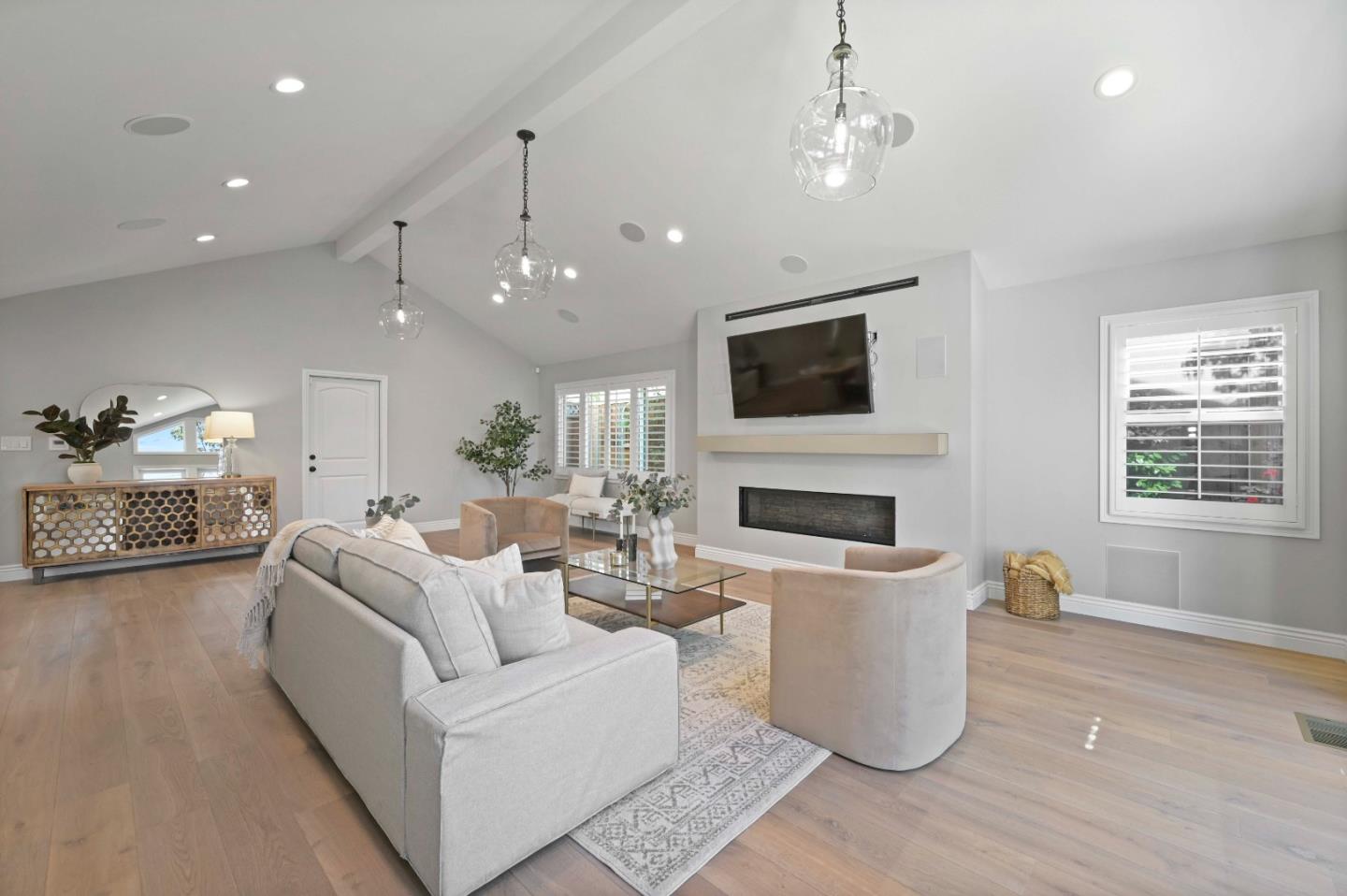 754 26th Avenue San Mateo, CA 94403 - Photo 53 of 57 a living room with furniture a fireplace and a flat screen tv