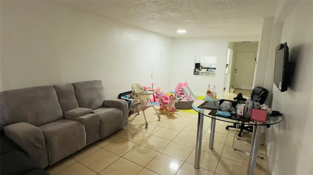 a kitchen with stainless steel appliances a sink a stove a refrigerator a counter top space and cabinets