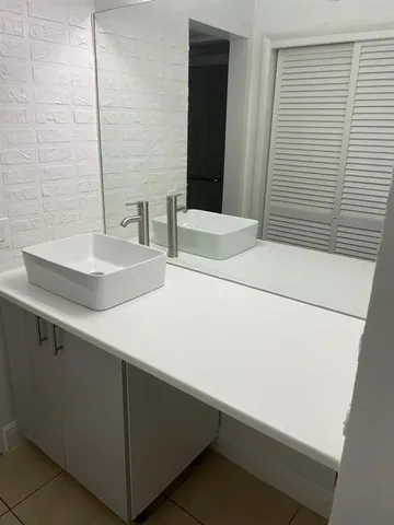 a close view of sink and a washer