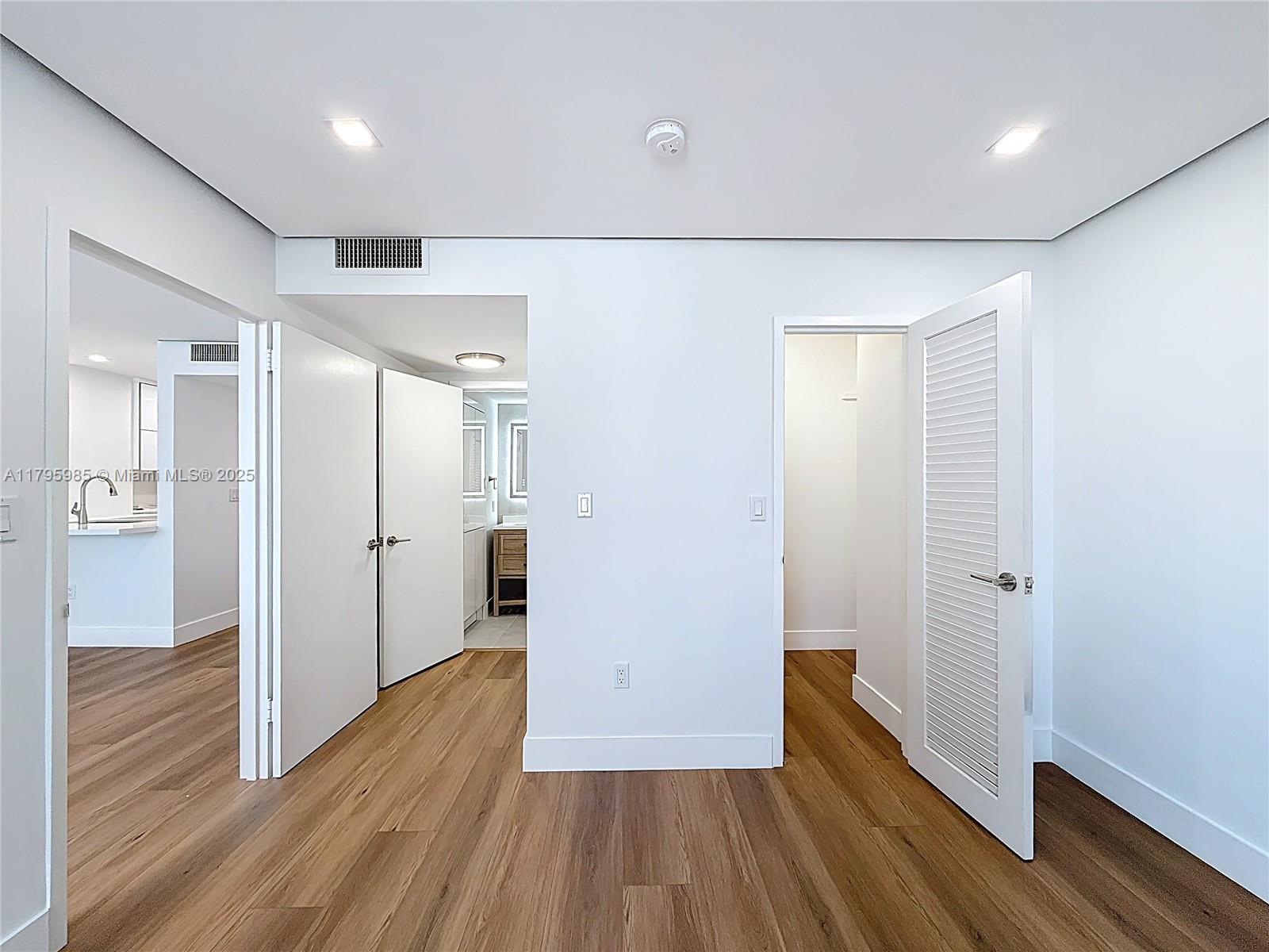 2899 Collins Avenue, Unit 1218 Miami Beach, FL 33140 - Photo 25 of 41 a view of hallway with wooden floor