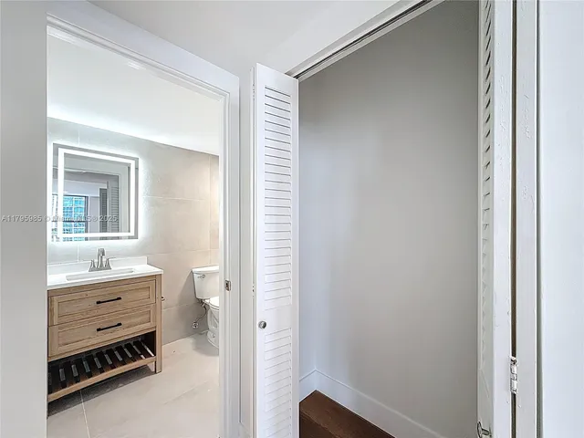 a room with a desk and a closet