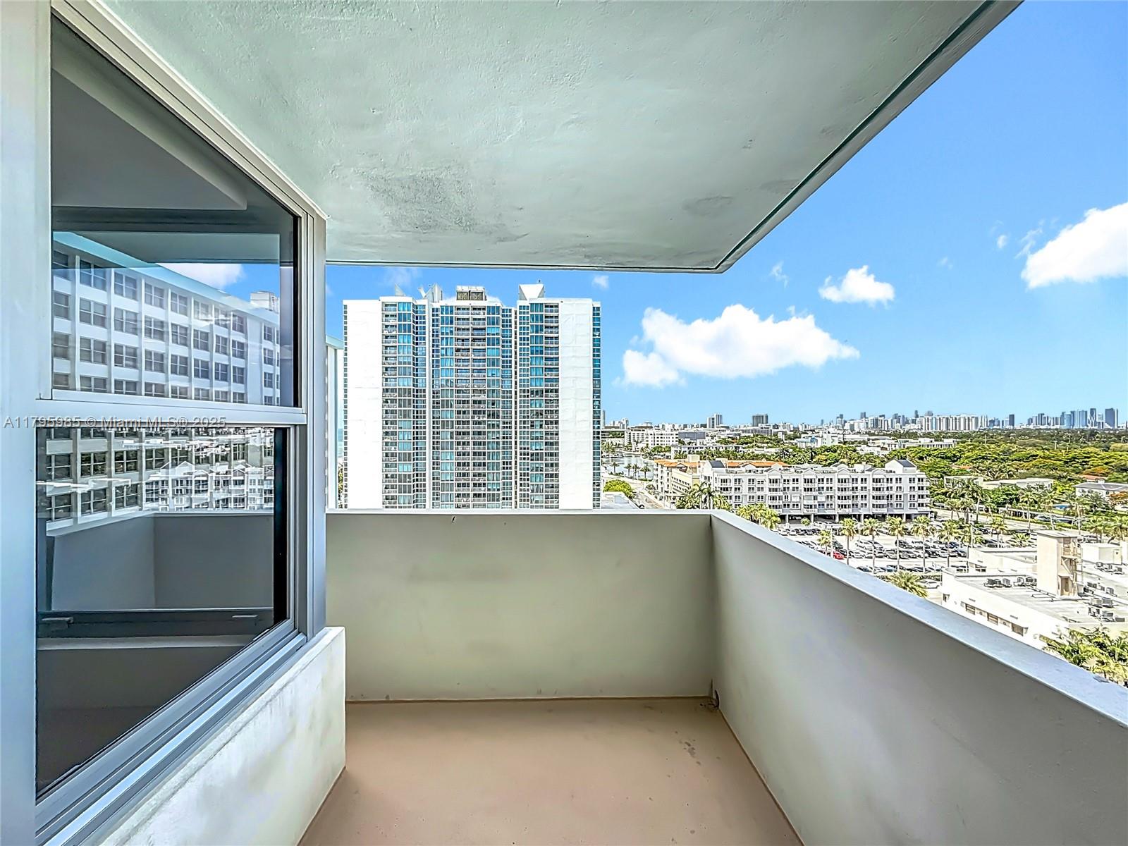 2899 Collins Avenue, Unit 1218 Miami Beach, FL 33140 - Photo 29 of 41 a view of an empty room with a floor to ceiling window and an outdoor view