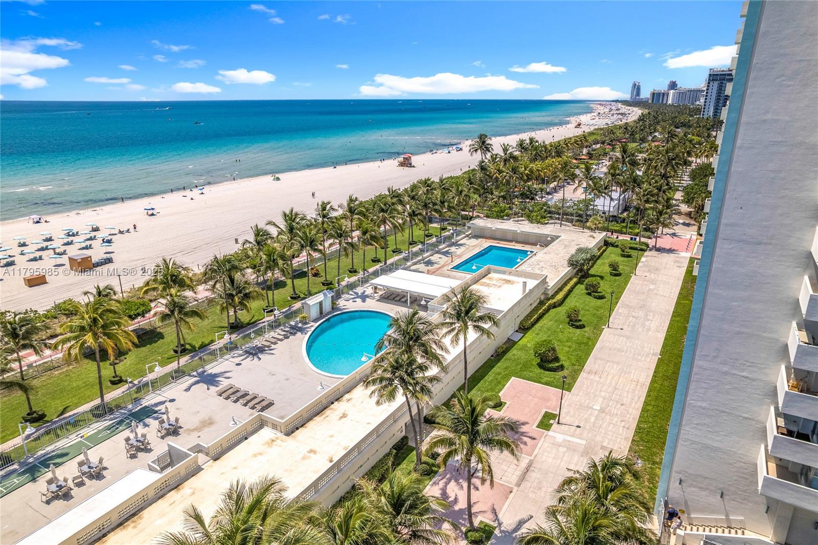 2899 Collins Avenue, Unit 1218 Miami Beach, FL 33140 - Photo 34 of 41 a view of a swimming pool with a yard