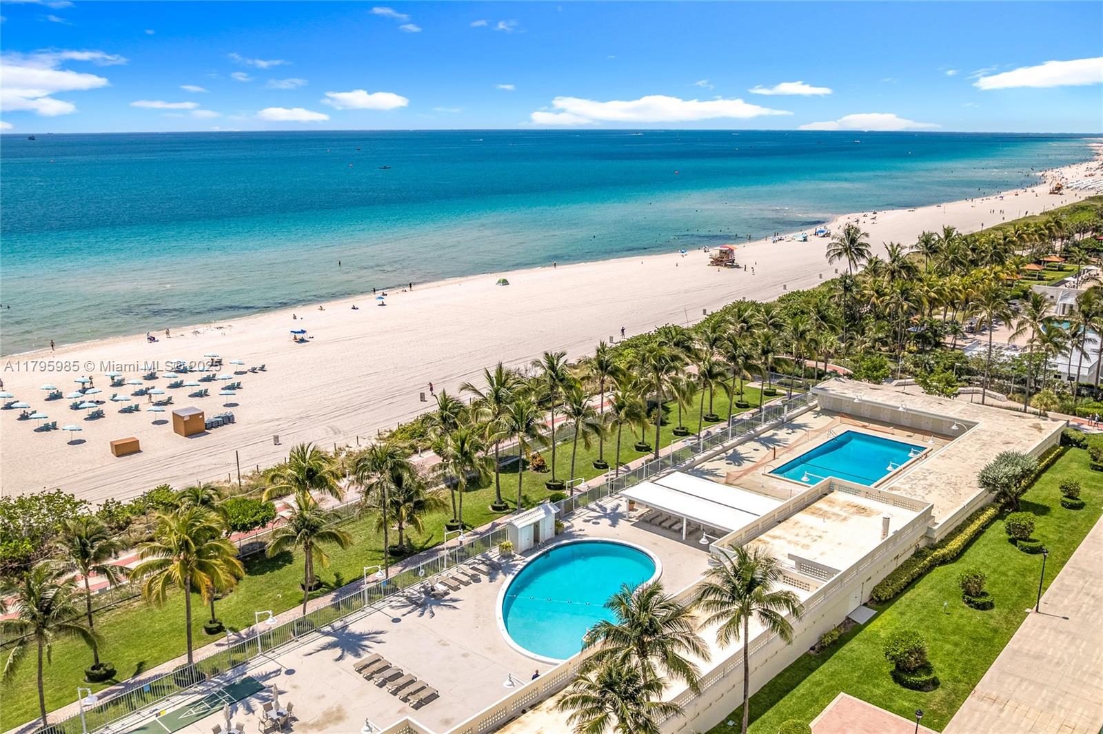 2899 Collins Avenue, Unit 1218 Miami Beach, FL 33140 - Photo 36 of 41 a view of a swimming pool with an outdoor seating
