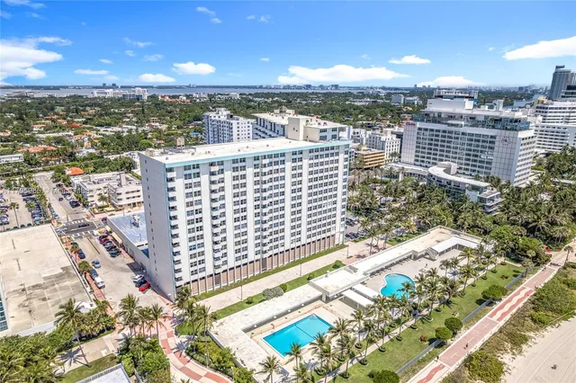 a view of a swimming pool with outdoor seating