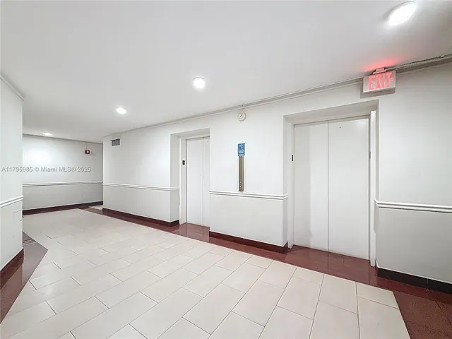 a view of an empty room and closet area