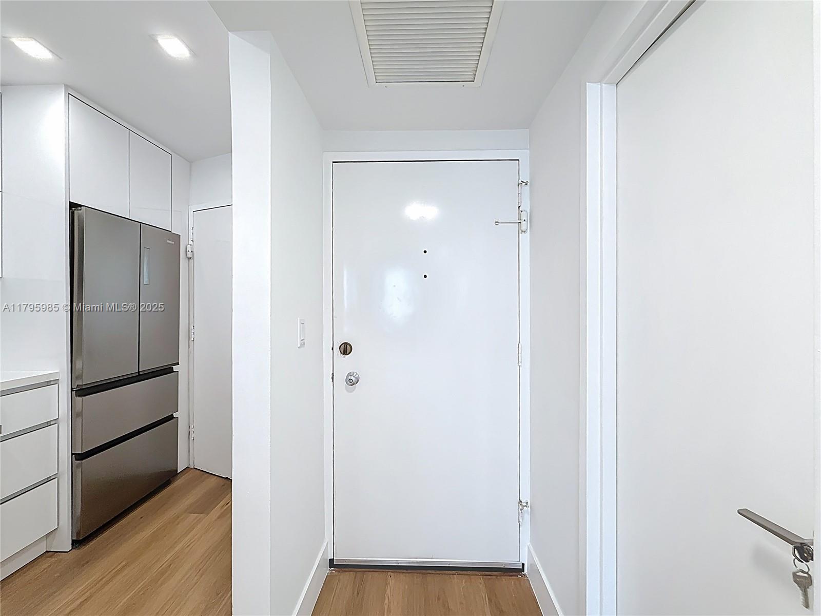 2899 Collins Avenue, Unit 1218 Miami Beach, FL 33140 - Photo 7 of 41 a view of bathroom with wooden floor