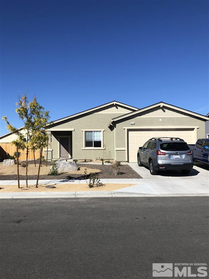9329 Lagoon Court Reno, NV 89506 - Photo 1 of 15 a view of a car parked in front of a house