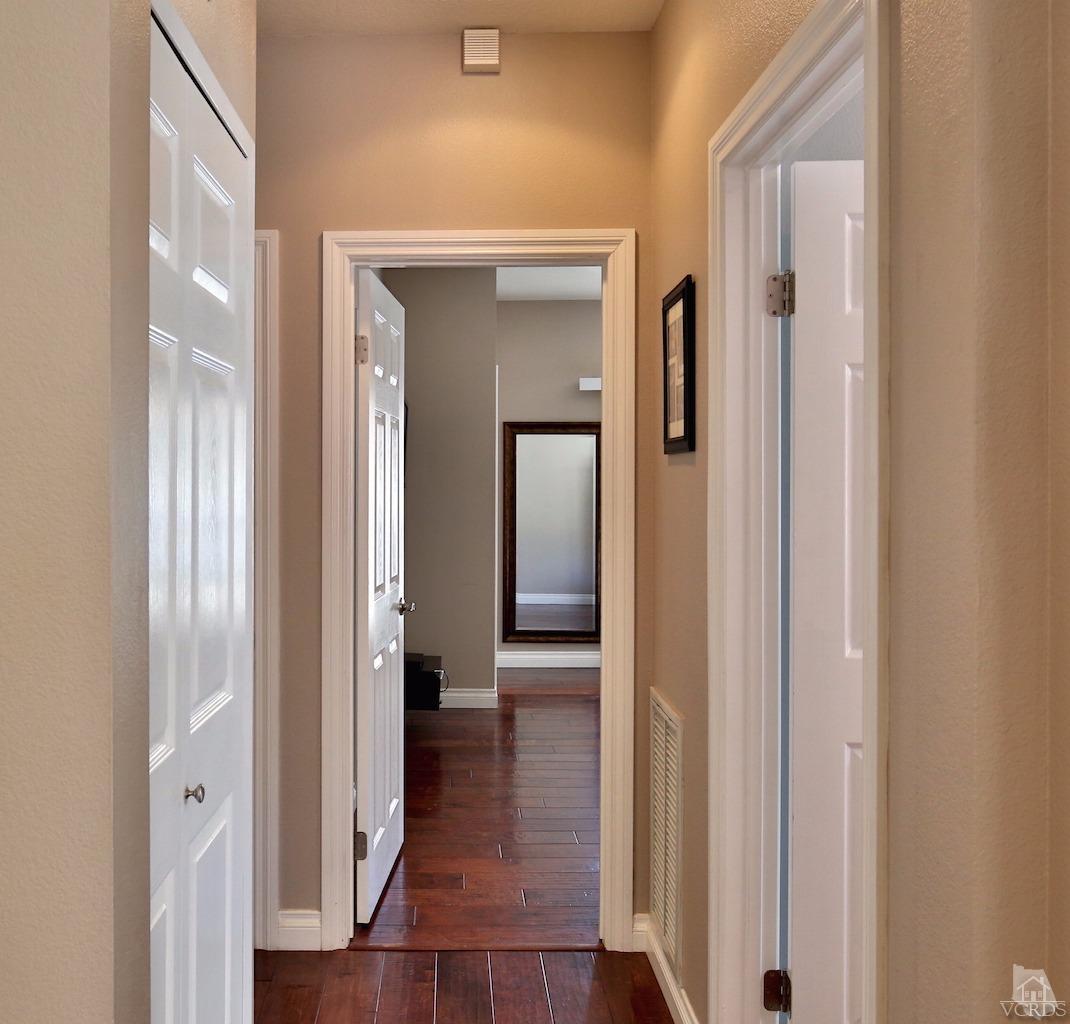 4241 Rusticview Court Moorpark, CA 93021 - Photo 12 of 26 a view of a hallway with wooden floor