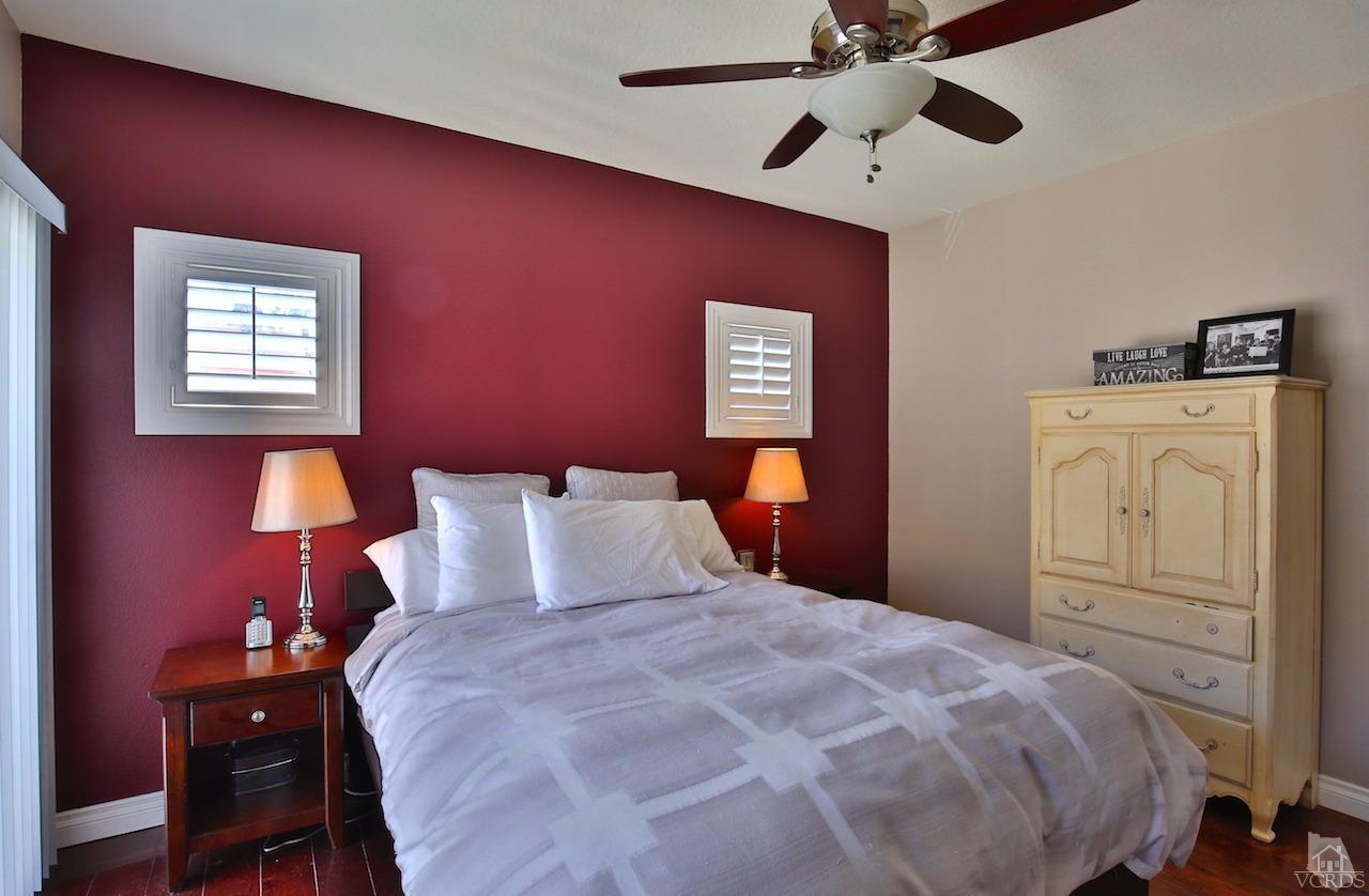 4241 Rusticview Court Moorpark, CA 93021 - Photo 14 of 26 a bedroom with a bed and a chandelier