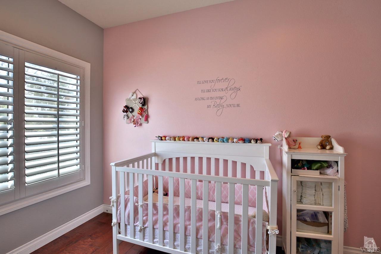 4241 Rusticview Court Moorpark, CA 93021 - Photo 20 of 26 a bedroom with furniture and a window