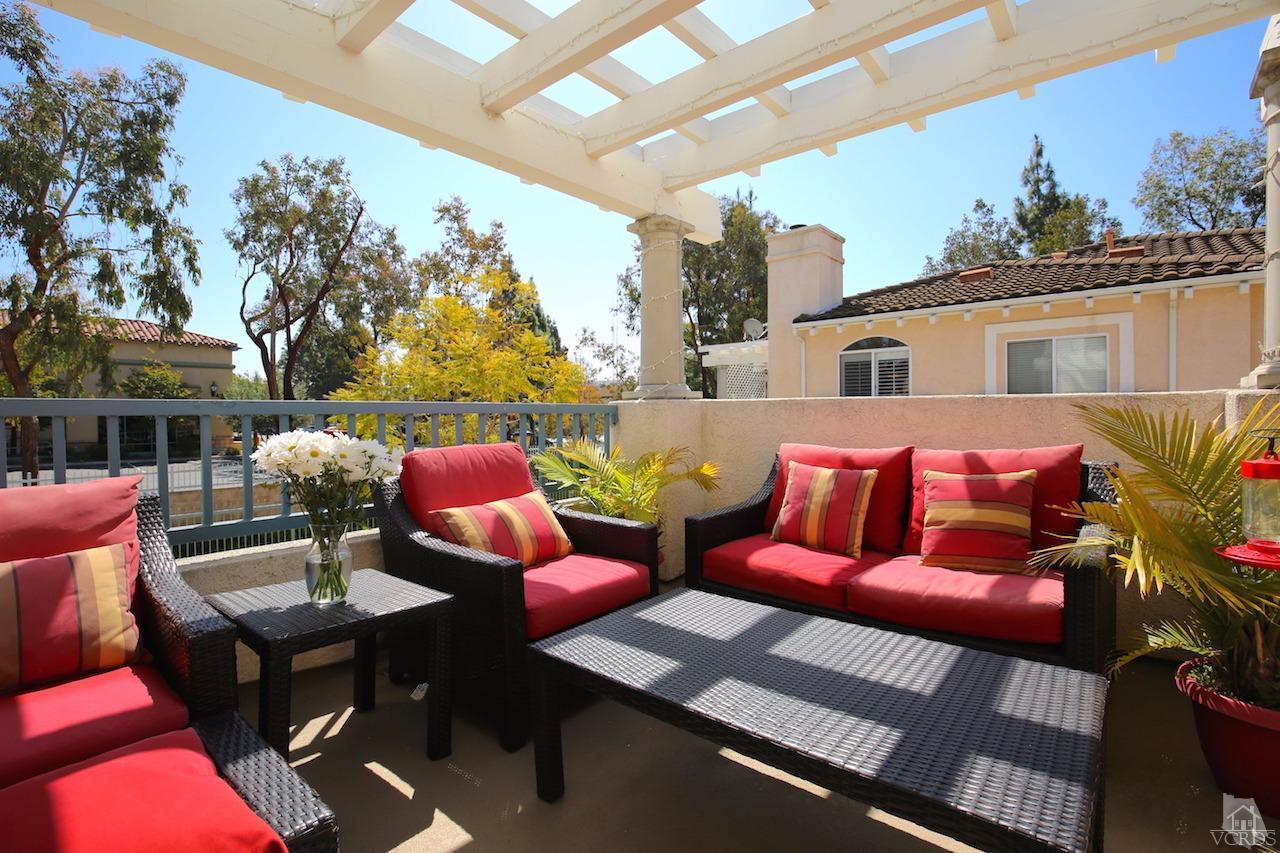 4241 Rusticview Court Moorpark, CA 93021 - Photo 24 of 26 a view of a patio with couches table and chairs and potted plants