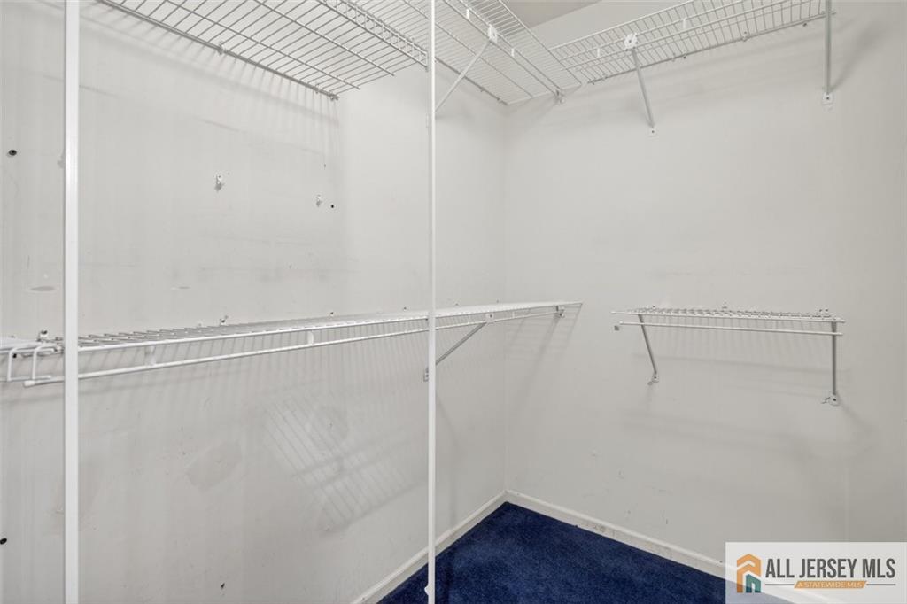 40C Rutland Lane, Unit 40B Monroe Township, NJ 08831 - Photo 23 of 37 a view of a room with racks on the wall