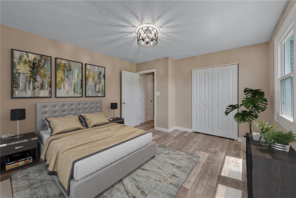 166 McConnell Road McDonald, PA 15057 - Photo 12 of 25 a bedroom with a bed and a potted plant