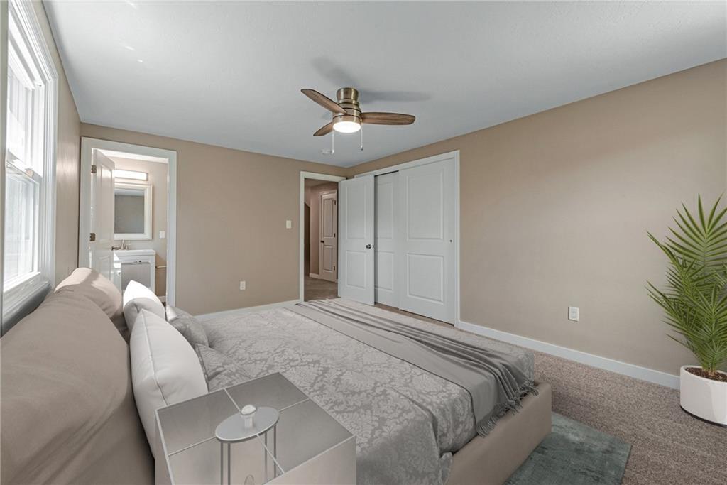 166 McConnell Road McDonald, PA 15057 - Photo 14 of 25 a spacious bedroom with a bed and a potted plant