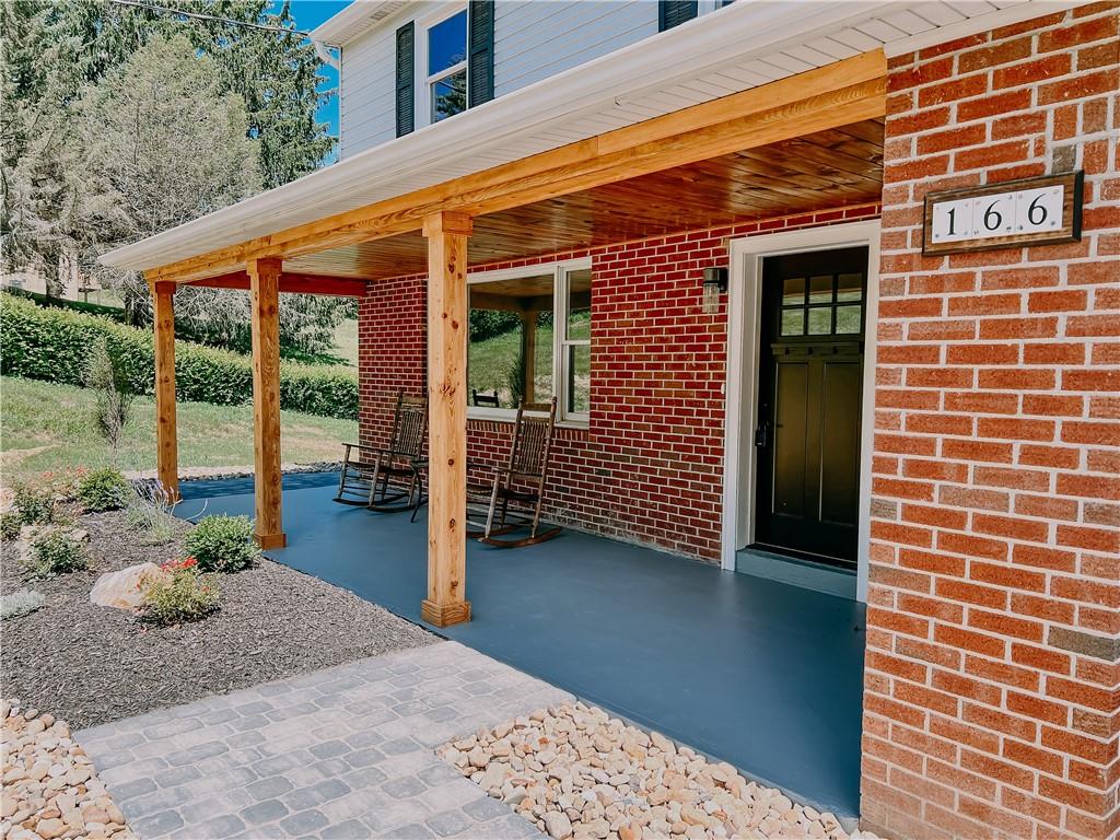 166 McConnell Road McDonald, PA 15057 - Photo 3 of 25 a view of a patio with furniture and floor to ceiling window
