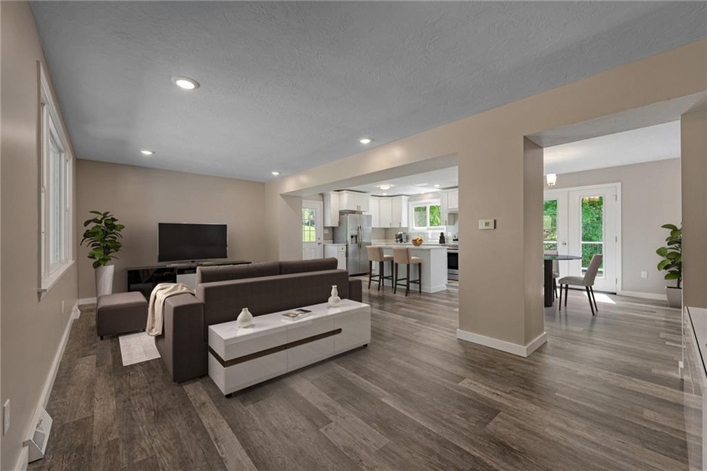166 McConnell Road McDonald, PA 15057 - Photo 4 of 25 a living room with furniture and a flat screen tv