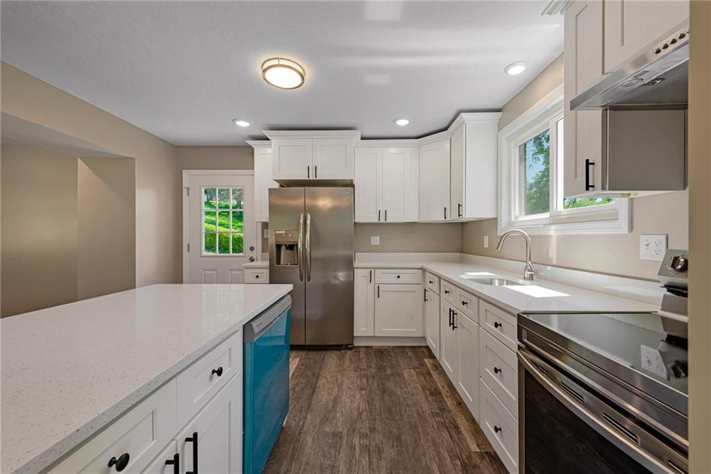 166 McConnell Road McDonald, PA 15057 - Photo 7 of 25 a kitchen with a sink a refrigerator and cabinets
