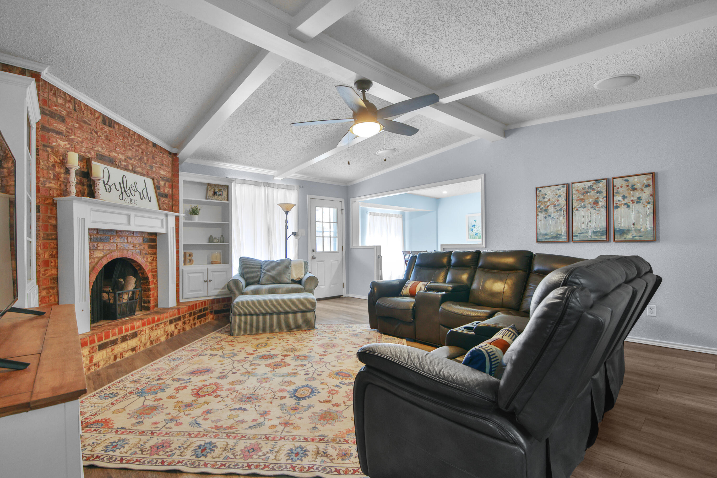 4805 73rd Street Lubbock, TX 79424 - Photo 6 of 26 a living room with furniture and a fireplace