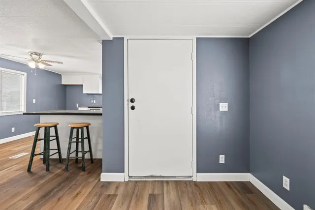 a view of kitchen with furniture and wooden floor