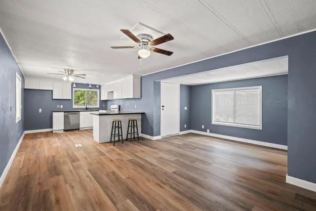 a view of kitchen with cabinets and wooden floor