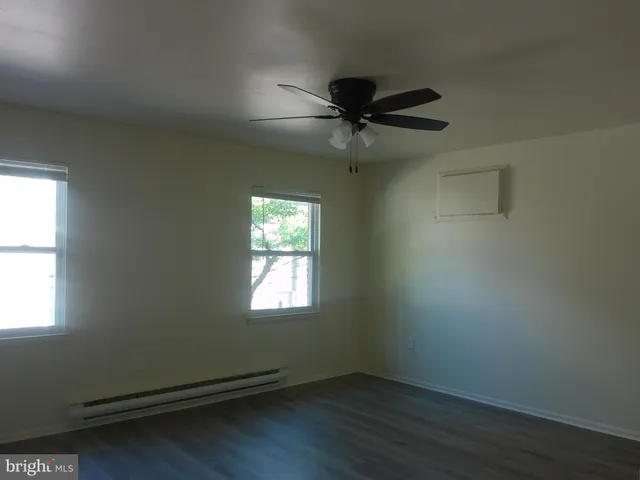 a bathroom with a toilet and a bathtub