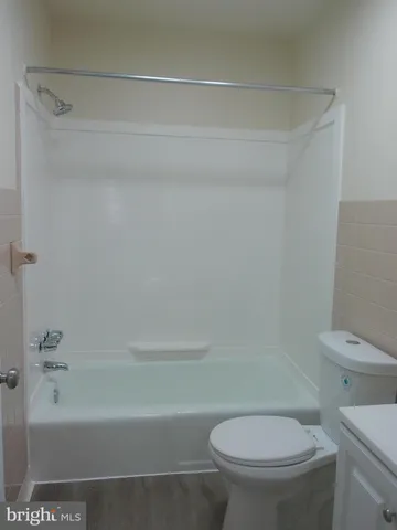 a bathroom with a sink toilet and vanity