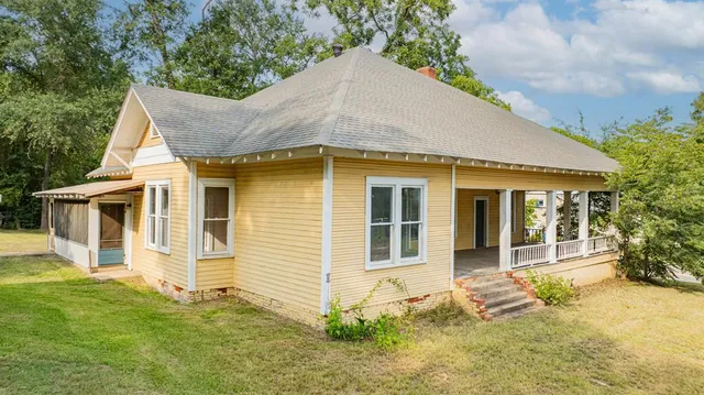 front view of a house with a yard
