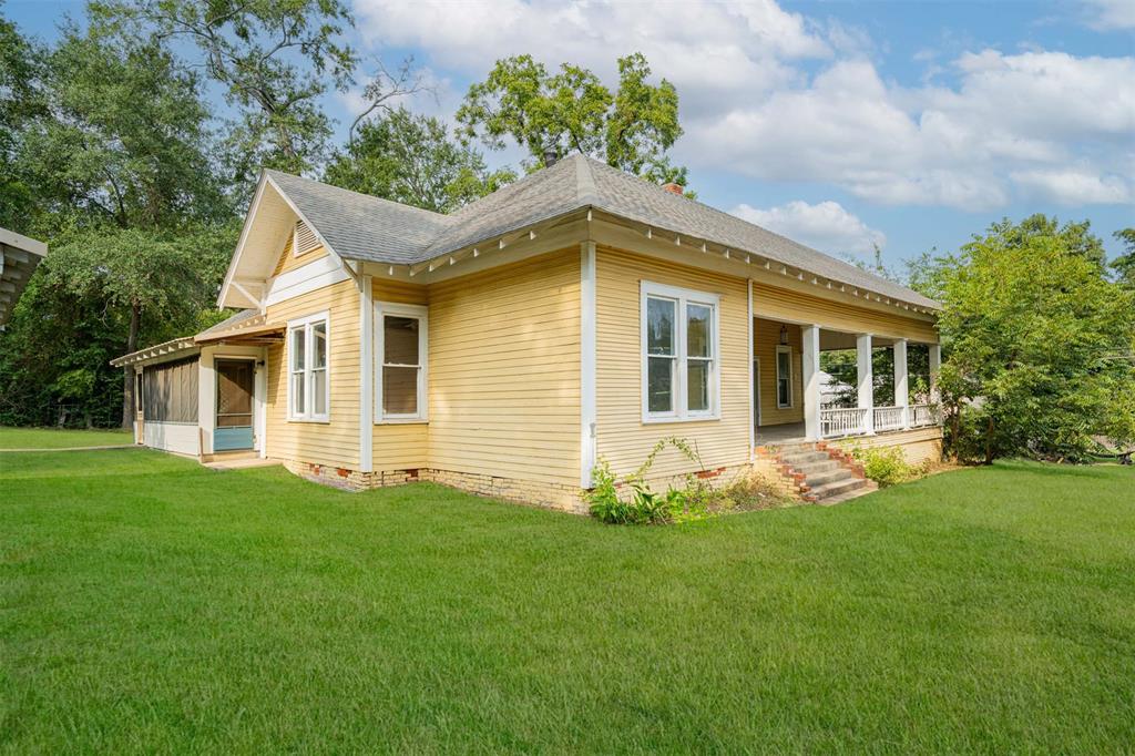 100 West Groves Street Big Sandy, TX 75755 - Photo 23 of 30 a front view of a house with a yard