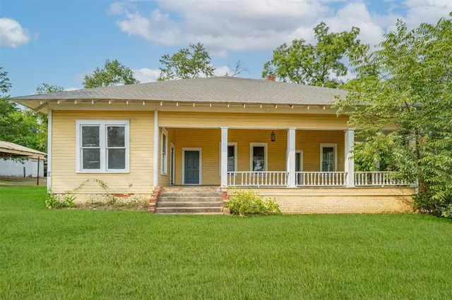 front view of a house with a yard