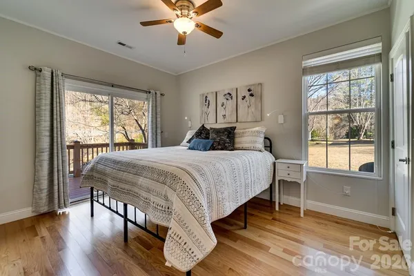 a bedroom with a large bed and a large window
