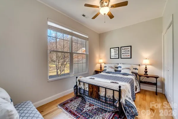 a bed room with a bed and a window