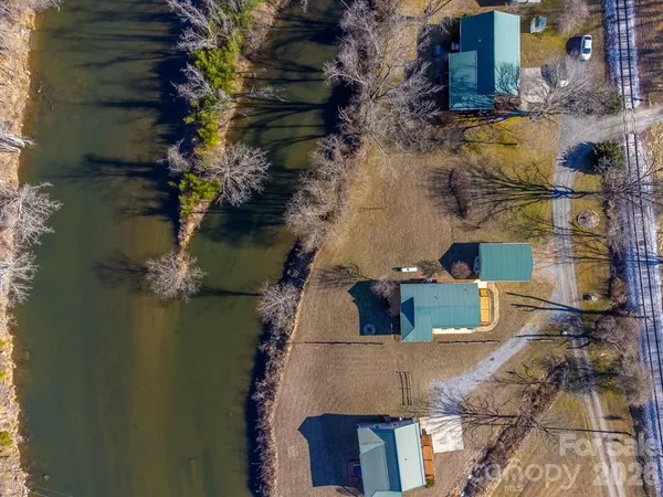 an aerial view of a house with a lake view