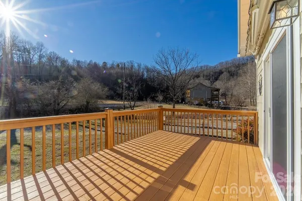 a view of balcony with wooden floor and outdoor space