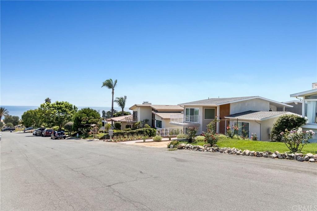5 Clipper Road, Unit C Rancho Palos Verdes, CA 90275 - Photo 7 of 12 a front view of a building with table and chairs