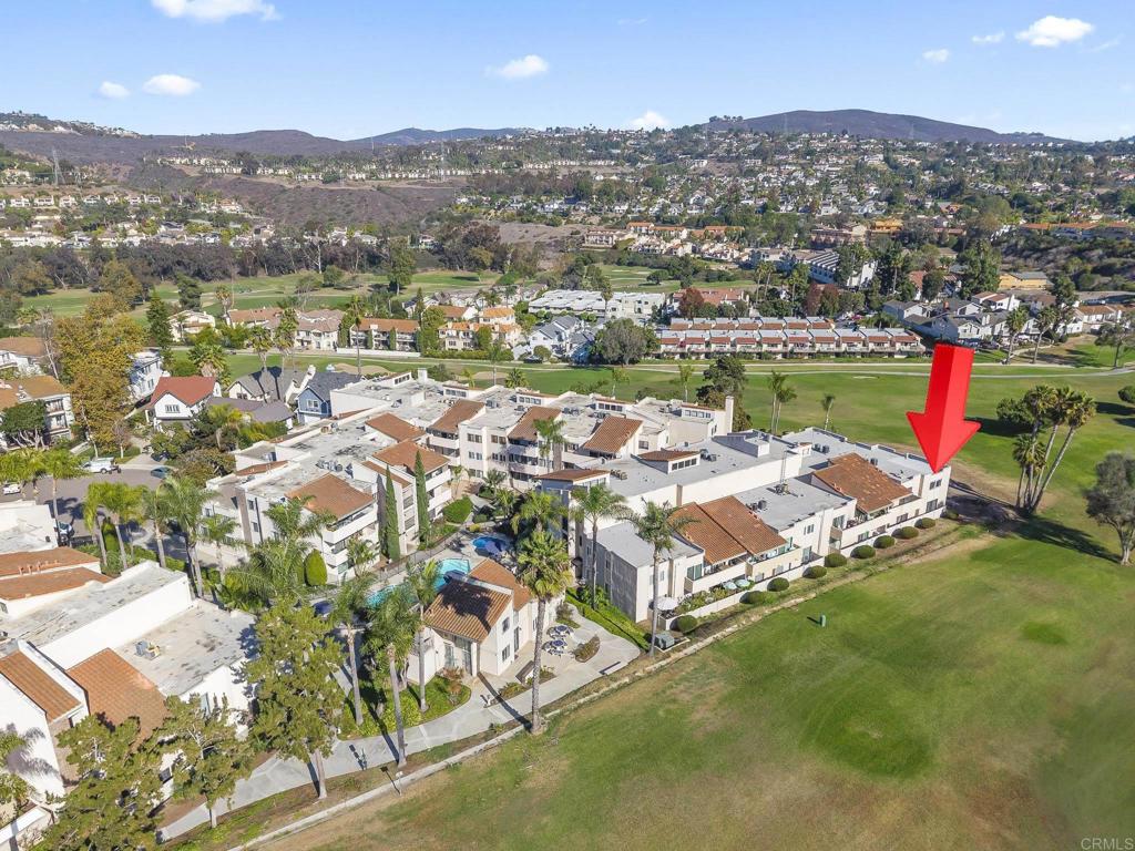 2639 Pirineos Way, Unit 231 Carlsbad, CA 92009 - Photo 2 of 34 an aerial view of residential houses with outdoor space and swimming pool