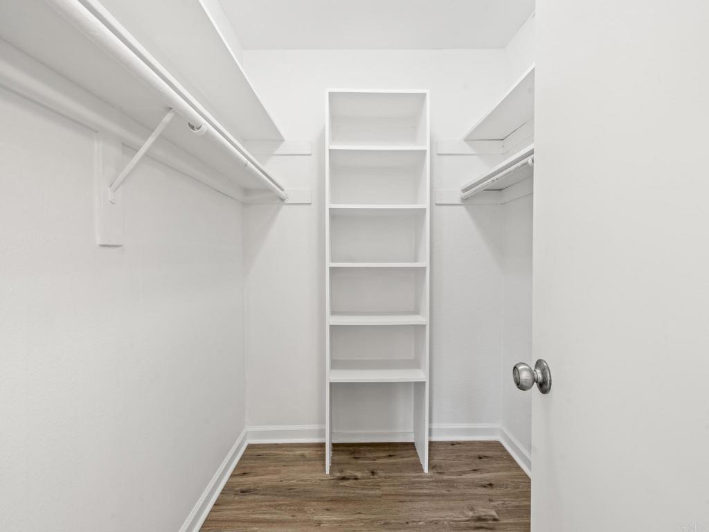 2639 Pirineos Way, Unit 231 Carlsbad, CA 92009 - Photo 21 of 34 a view of walk in closet with empty racks