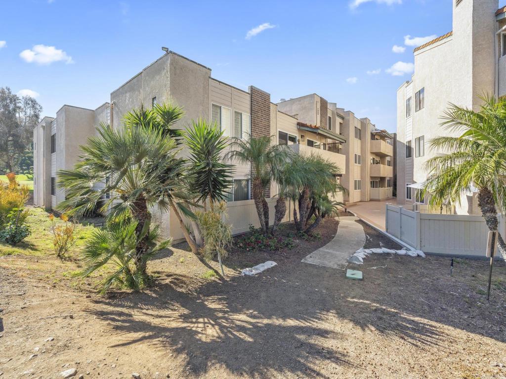 2639 Pirineos Way, Unit 231 Carlsbad, CA 92009 - Photo 26 of 34 a view of a palm plants next to a road