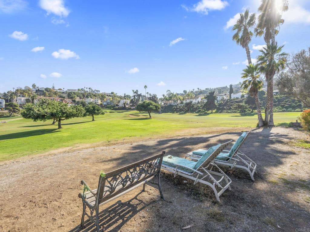 2639 Pirineos Way, Unit 231 Carlsbad, CA 92009 - Photo 28 of 34 a view of a swimming pool and lounge chairs
