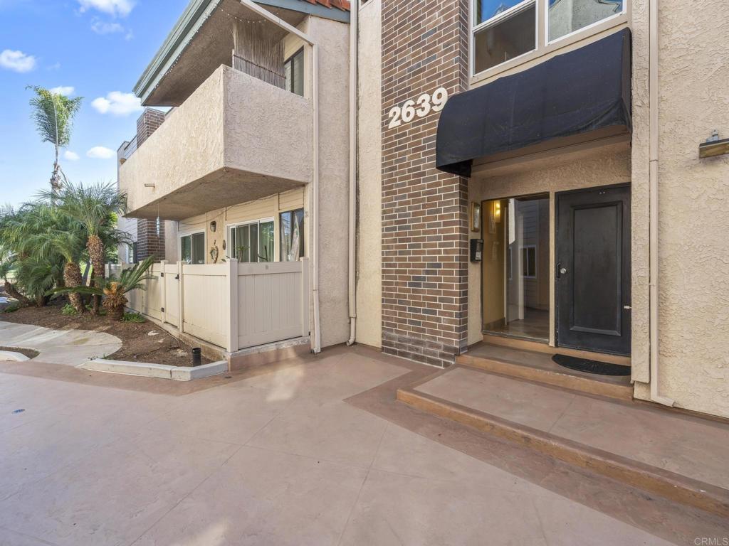 2639 Pirineos Way, Unit 231 Carlsbad, CA 92009 - Photo 29 of 34 a view of a house with a yard