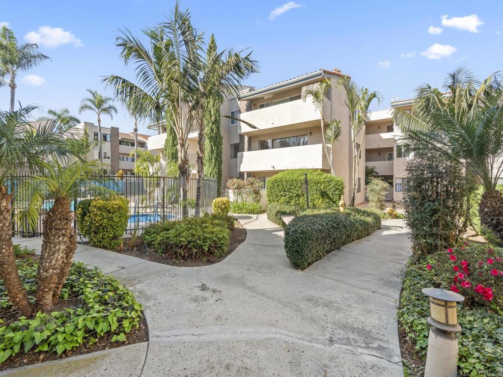 2639 Pirineos Way, Unit 231 Carlsbad, CA 92009 - Photo 30 of 34 a front view of a house having yard