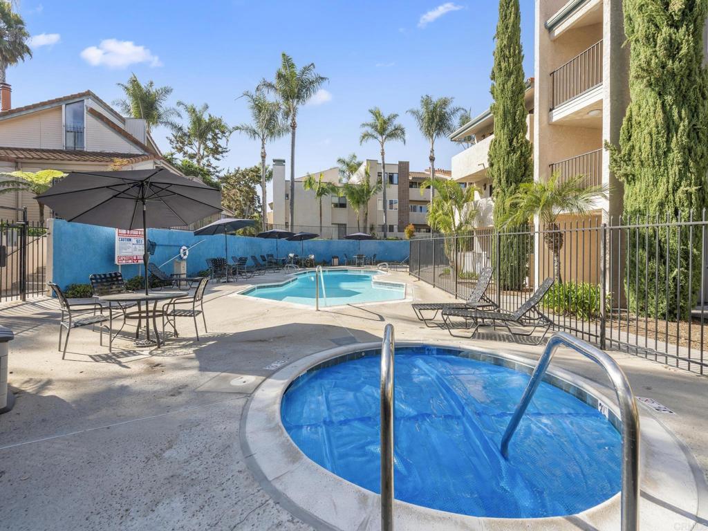 2639 Pirineos Way, Unit 231 Carlsbad, CA 92009 - Photo 31 of 34 a view of a swimming pool with a patio