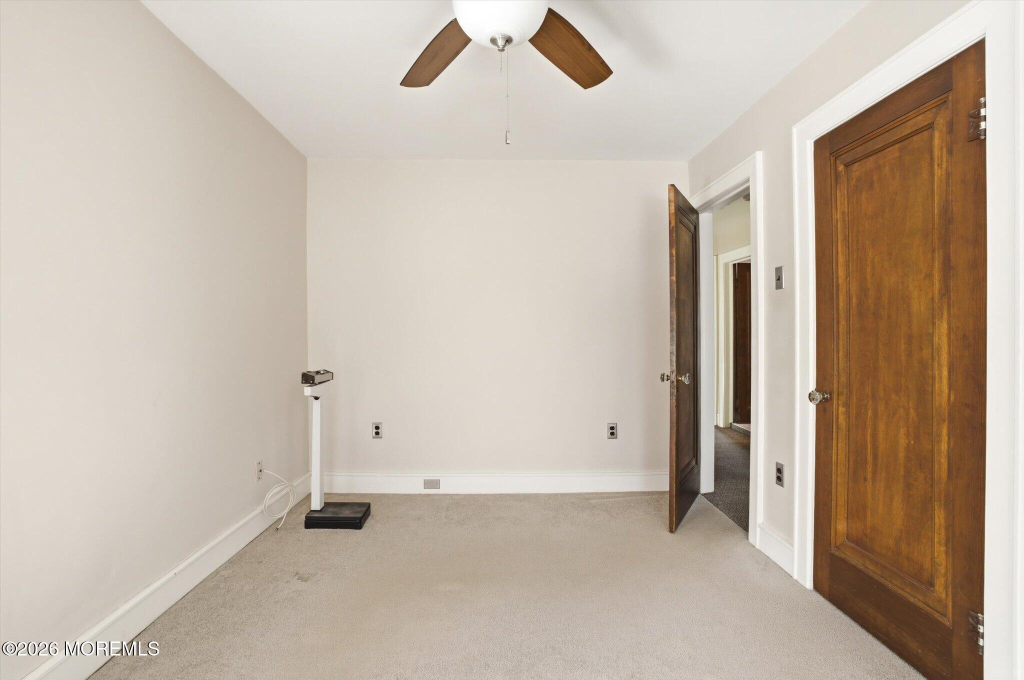 4121 Nottingham Way Hamilton, NJ 08690 - Photo 14 of 24 an empty room with closet and a chandelier fan